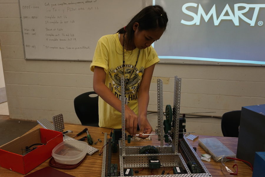 Students in the NHIS Robotics Club work on building robots that compete against other schools.