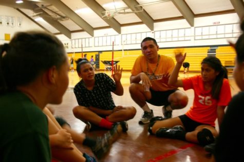 Jeff Uyemura-Reyes, NHIS JV Girl's Volleyball coach works with his team.