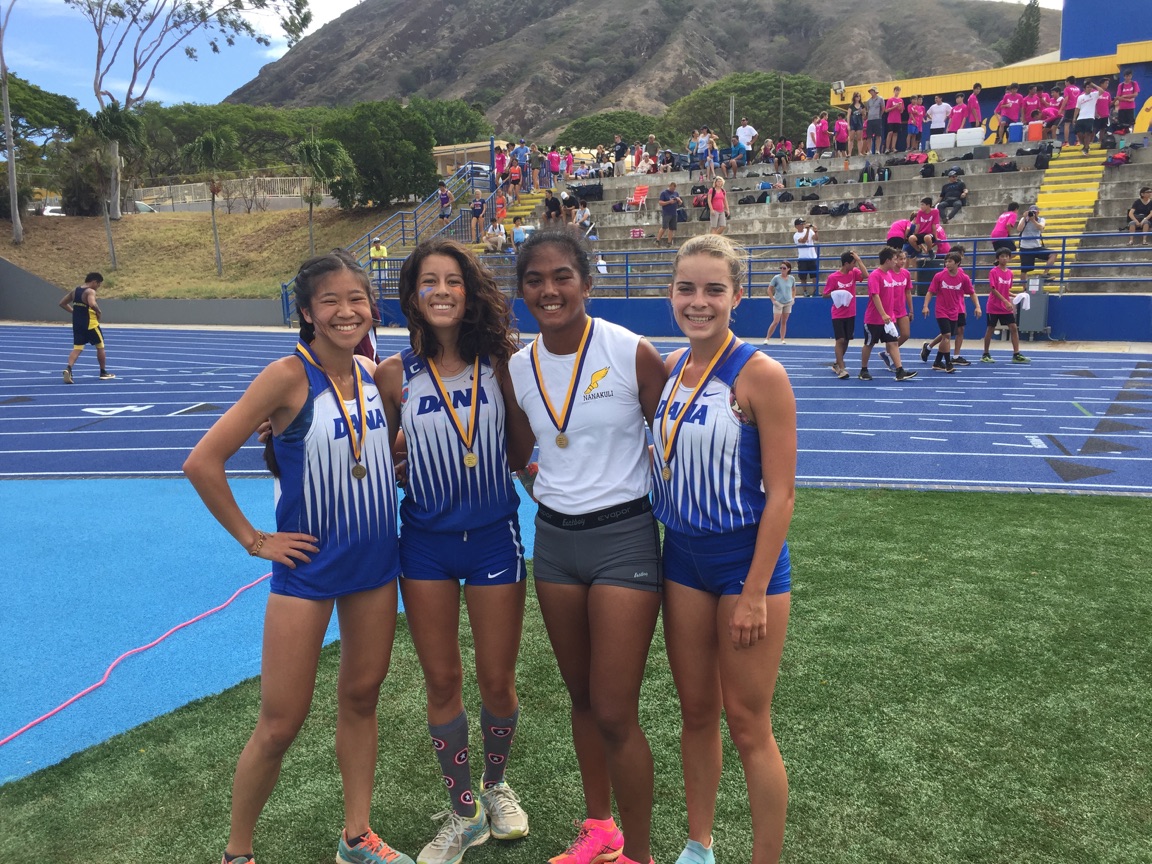 Kili Kawaiaea (in white) poses with three of the other race medalists from Dana Hills HS in California.