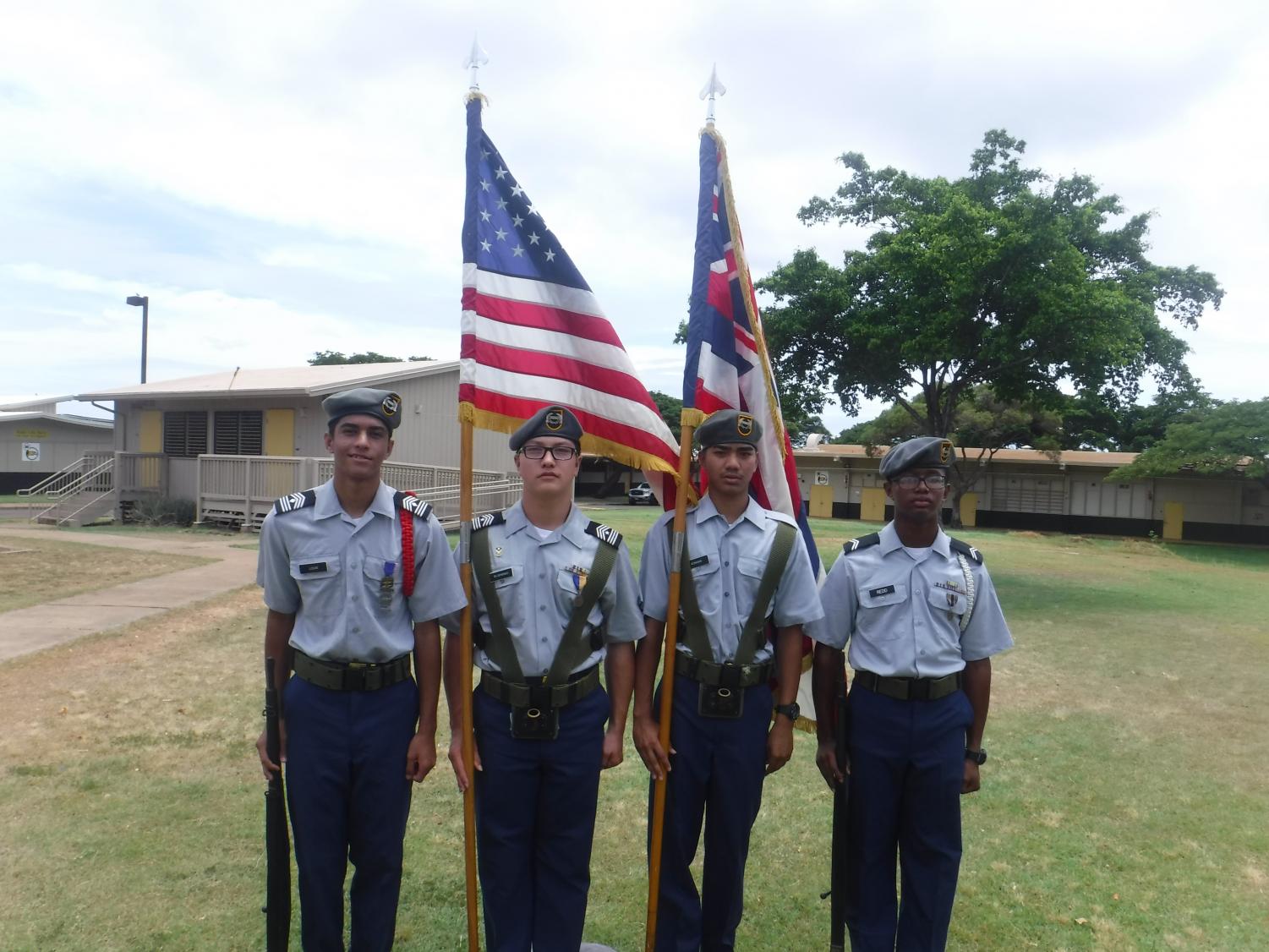 The NHIS JROTC Color Guard, comprised of students Djay Louis, Kainalu Glushenko, Andrew Koniske, and Devaughn Redd (pictured left to right).