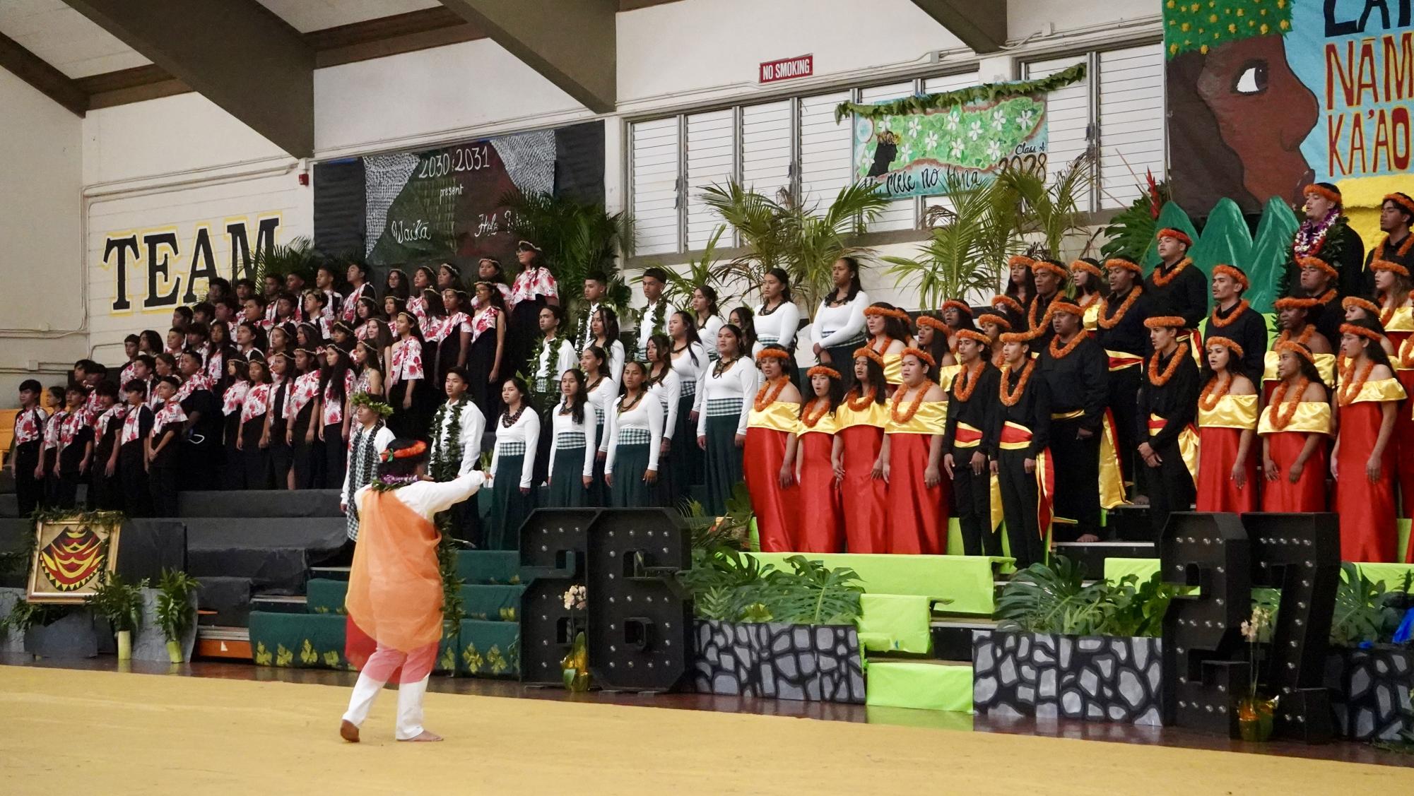 Senior-Junior Class Song Leader Alvin Vitale proudly leads the fellow classes in starting the 34th Annual Songfest.